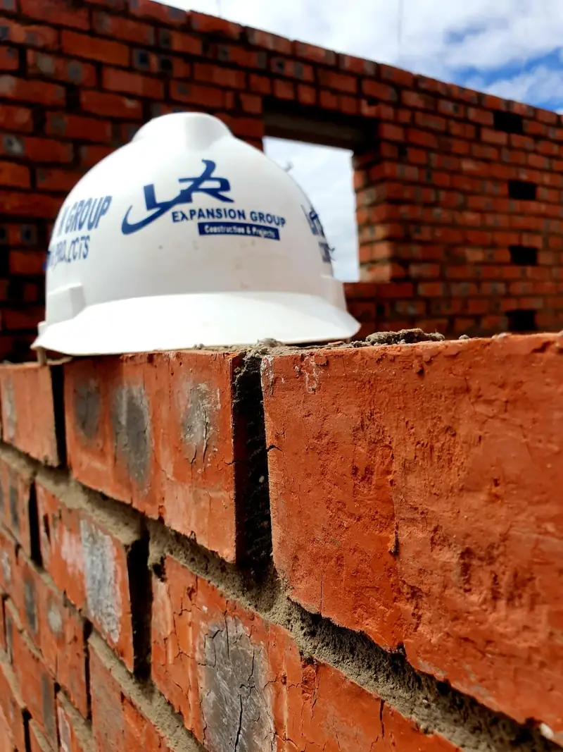 Site helmet on fresh brickwork